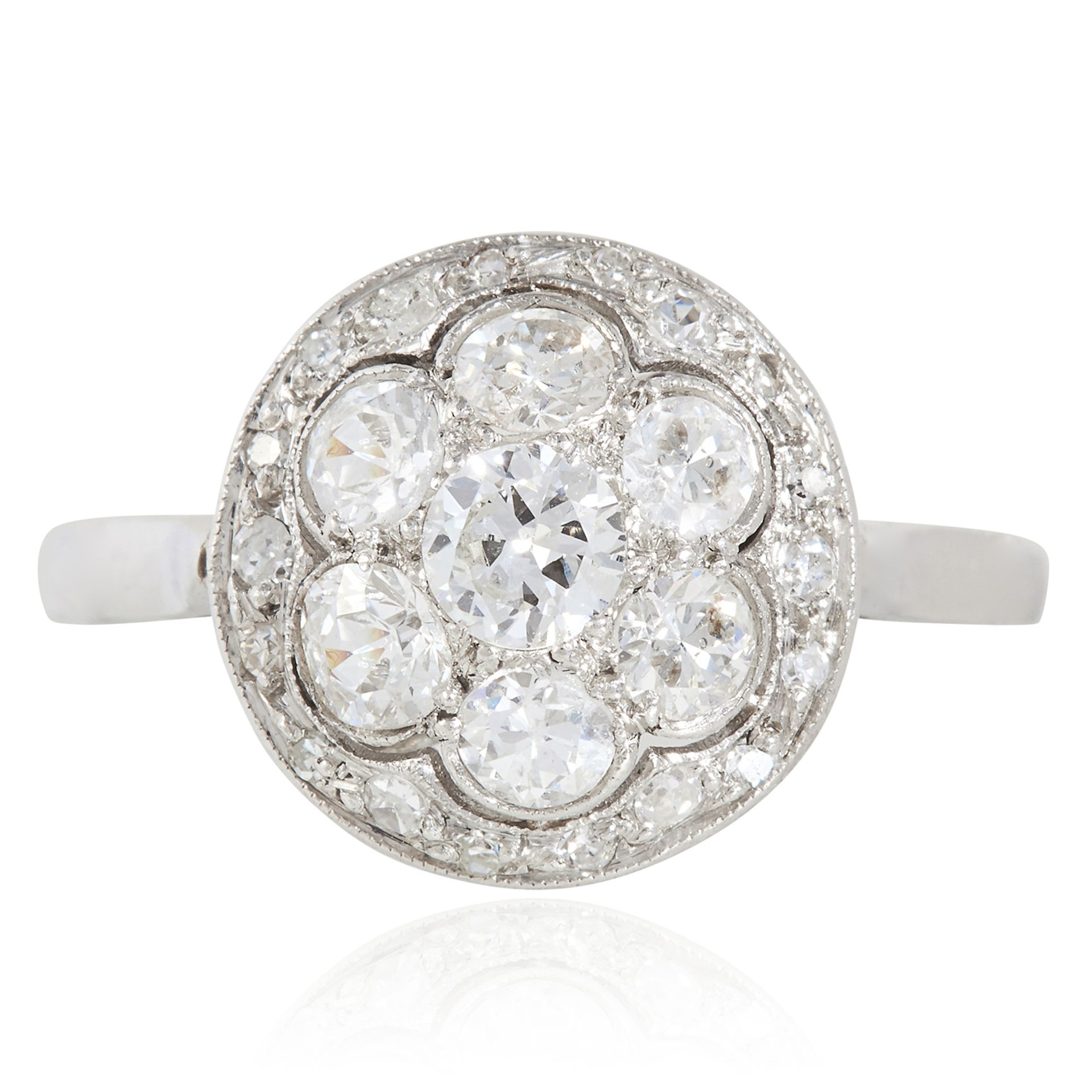 A DIAMOND CLUSTER DRESS RING, CIRCA 1940 in platinum or white gold, the circular face set with round