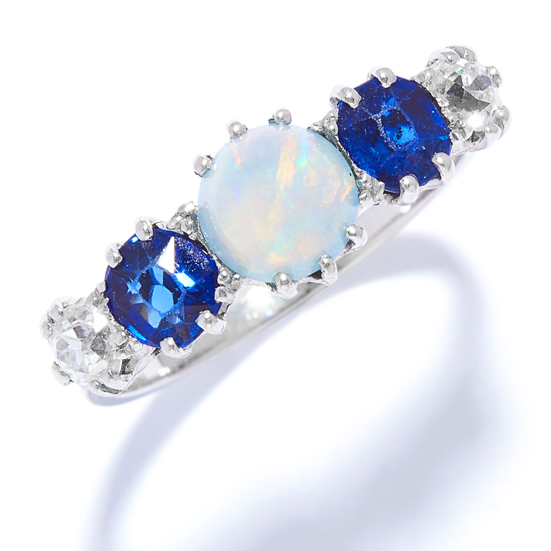 AN OPAL, SAPPHIRE AND DIAMOND DRESS RING in white gold or platinum, set with a cabochon opal between