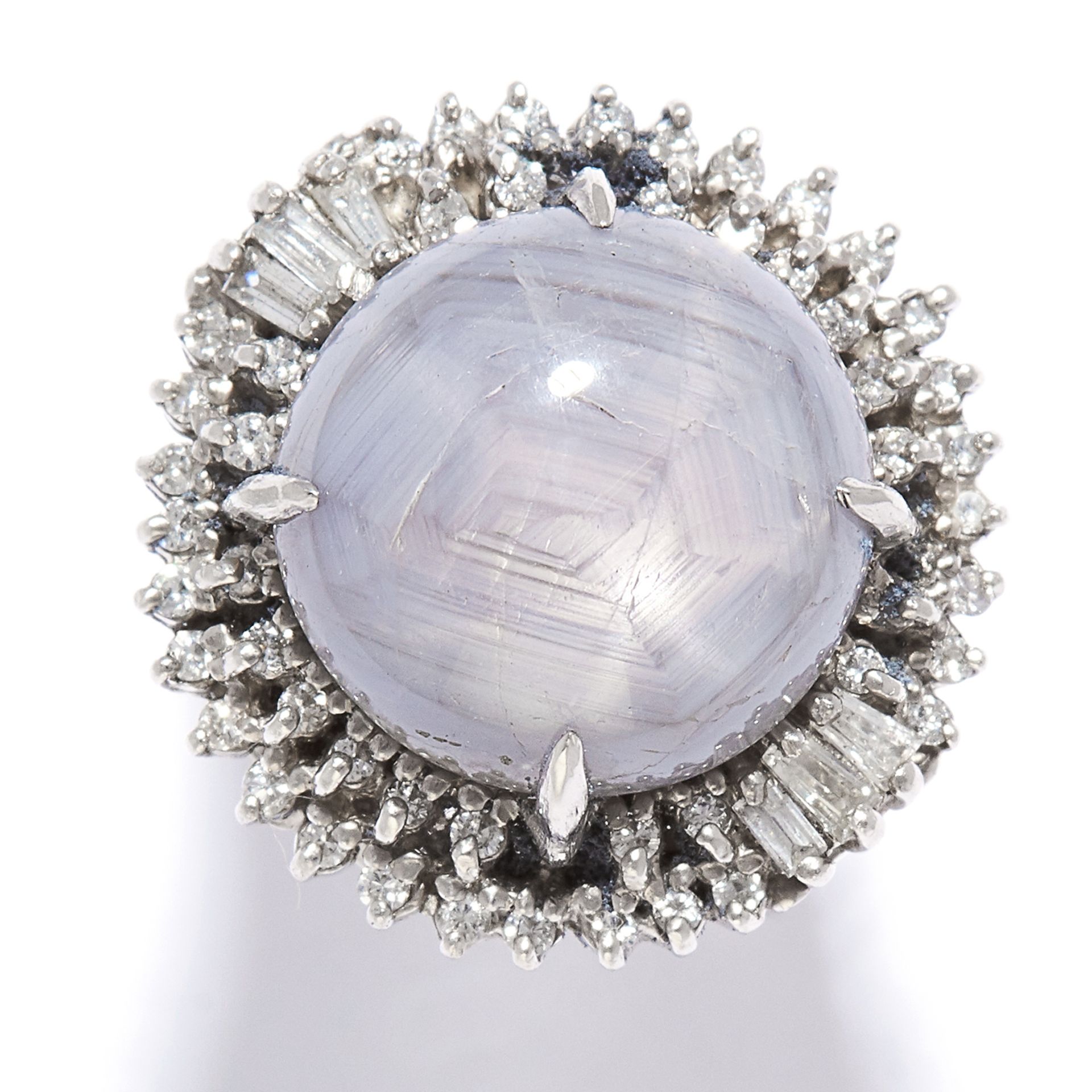 9.20 CARAT STAR SAPPHIRE AND DIAMOND CLUSTER in platinum, set with a star sapphire of