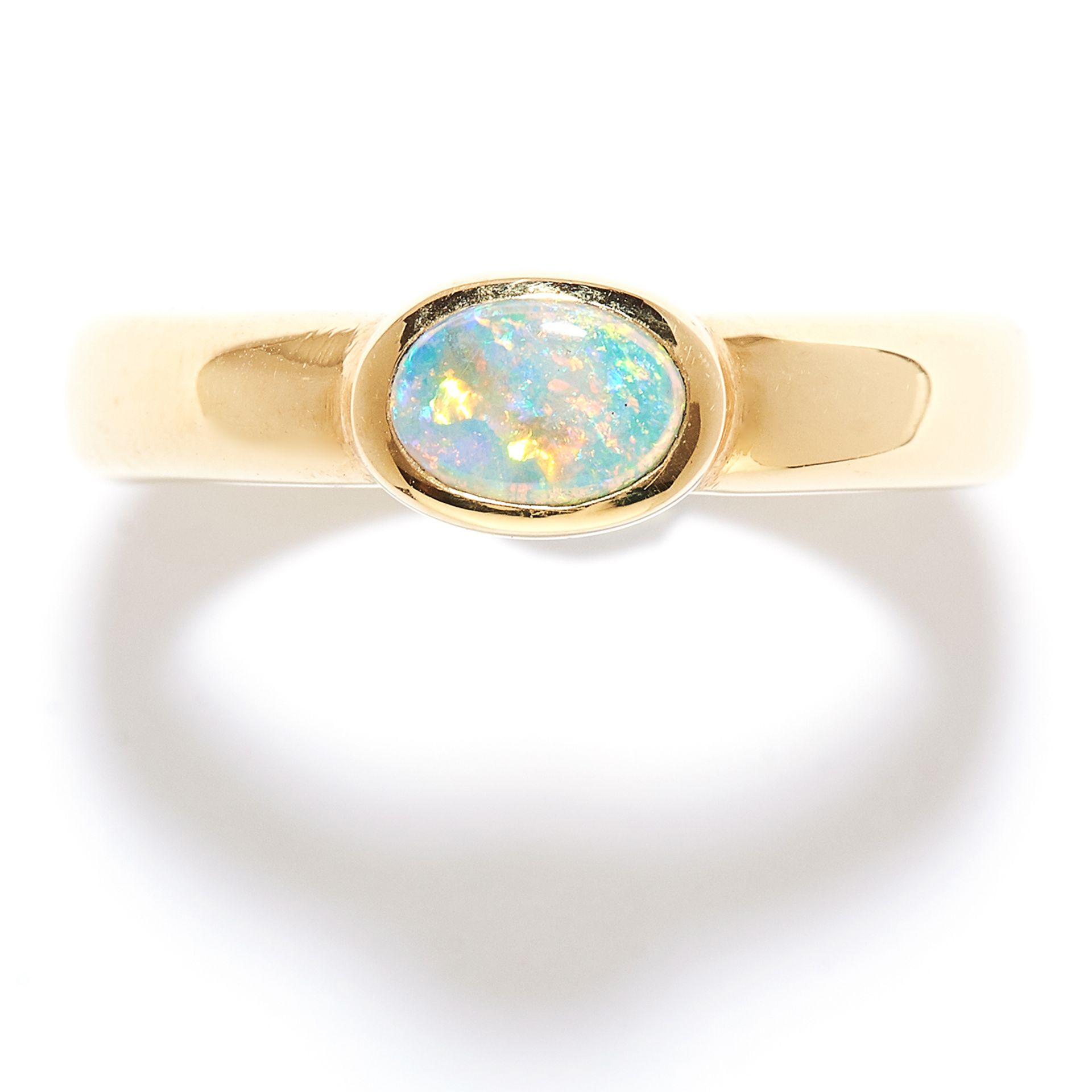 OPAL DRESS RING, 1970s in 18ct yellow gold, the oval cabochon opal within a stylised band, stamped