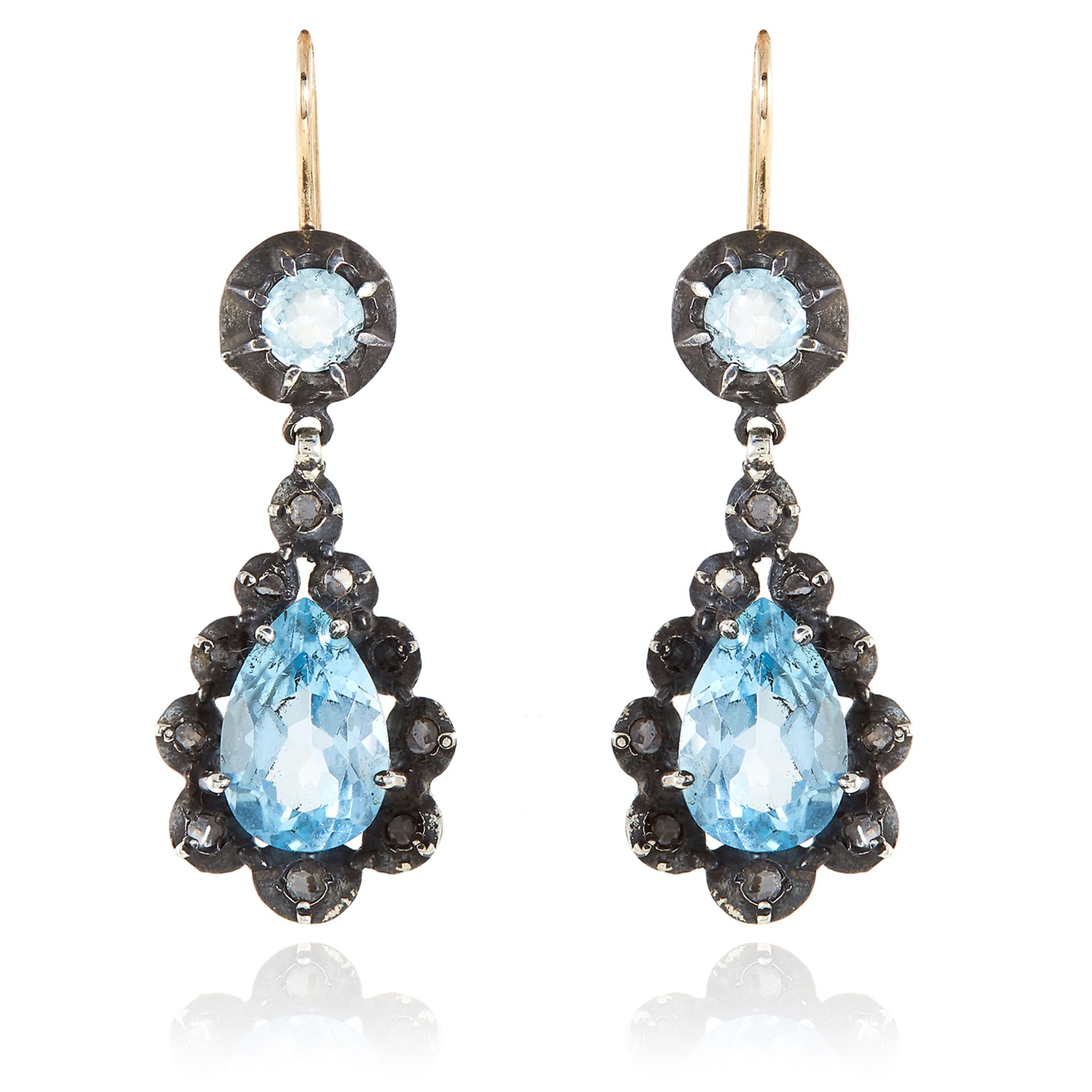 A PAIR OF ANTIQUE AQUAMARINE AND DIAMOND EARRINGS in silver and gold, each set with a pear cut