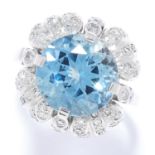 AQUAMARINE AND DIAMOND CLUSTER RING in white gold or platinum, set with a round cut aquamarine of