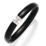 DIAMOND RUBBER BANGLE in platinum and 18ct yellow gold, set with a round cut diamond on a rubber