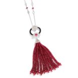 RUBY, DIAMOND AND ONYX TASSEL PENDANT in white gold or platinum, the ruby and round cut diamond