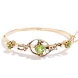 ANTIQUE PERIDOT, PEARL AND DIAMOND BANGLE in 15ct yellow gold, comprising of three oval cut peridot,