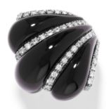ONYX AND DIAMOND DRESS RING, CIRCA 1940 in 18ct white gold, formed of three polished onyx and