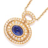 SAPPHIRE AND DIAMOND PENDANT in 18ct yellow gold, set with a cabochon sapphire in a border of