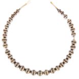 ANTIQUE TORTOISESHELL PIQUE BEAD NECKLACE in yellow gold, comprising of a single strand of beads