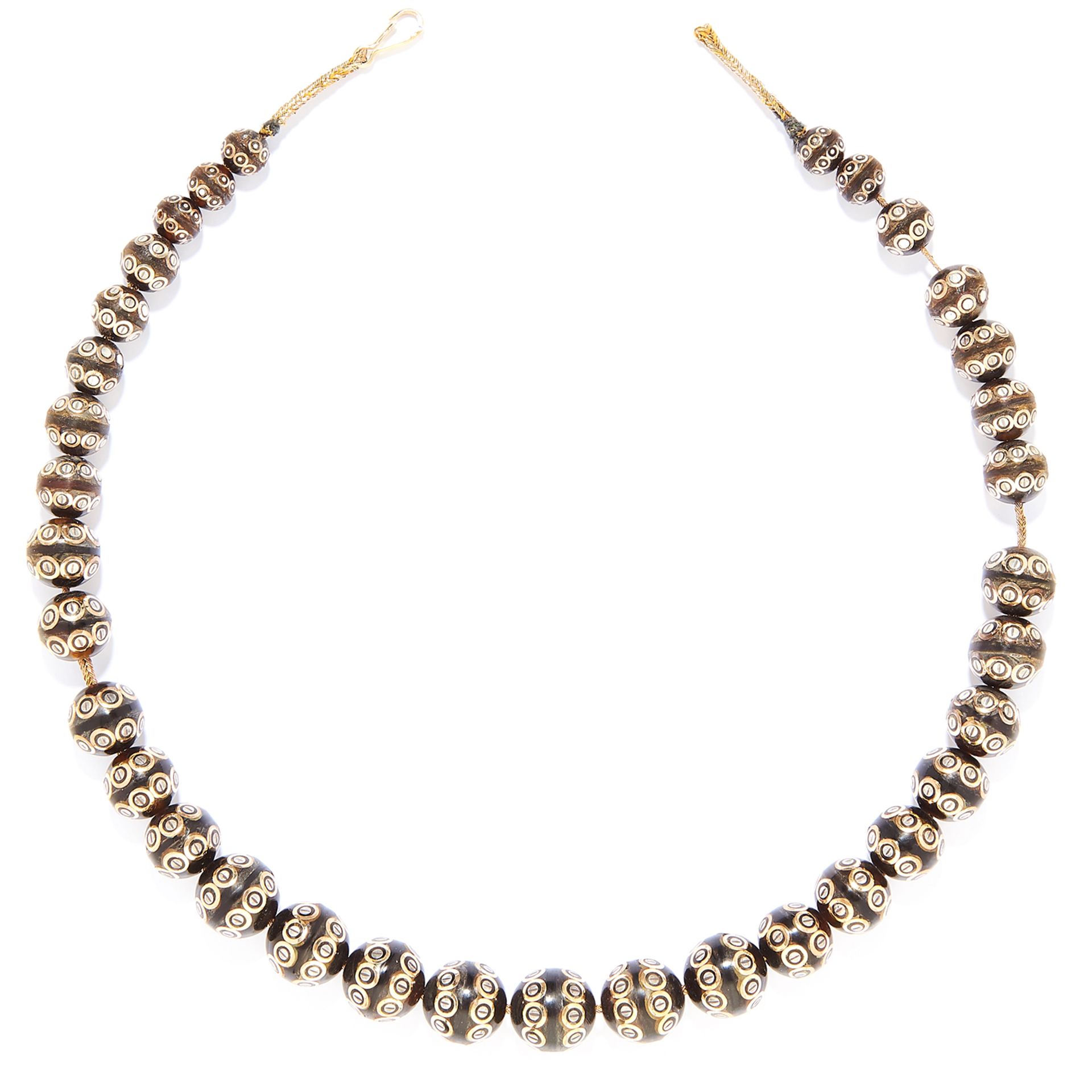 ANTIQUE TORTOISESHELL PIQUE BEAD NECKLACE in yellow gold, comprising of a single strand of beads