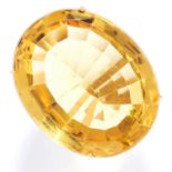 CITRINE AND DIAMOND DRESS RING in yellow gold, set with a large oval cut citrine with round cut