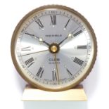 ALARM CLOCK, WEHRLE with quartz movement, in brown leather case, 235.3g.