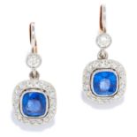 SAPPHIRE AND DIAMOND CLUSTER EARRINGS in 18ct gold or platinum, each set with a cushion cut sapphire
