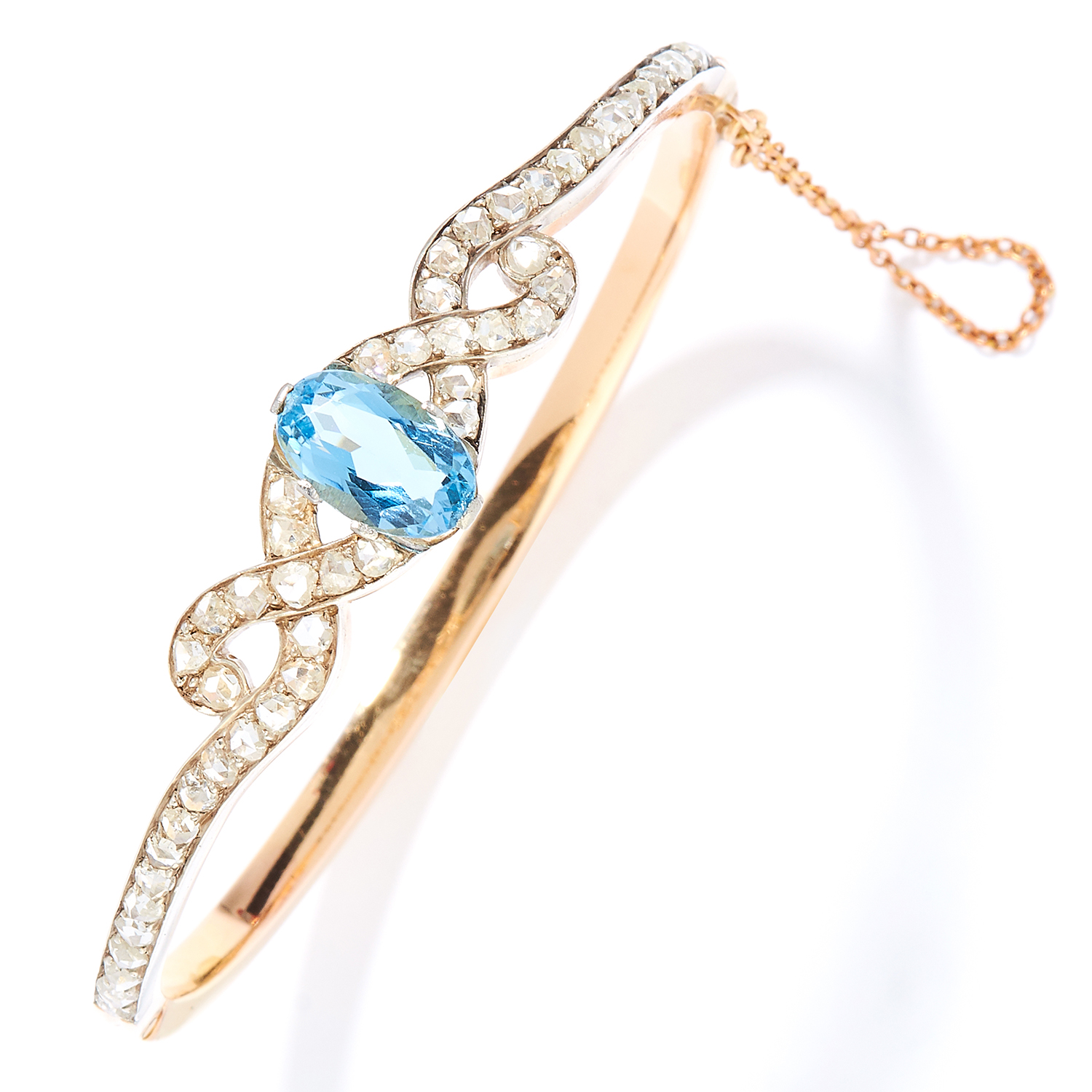 ANTIQUE AQUAMARINE AND DIAMOND BANGLE in high carat yellow gold, set with an oval cut aquamarine and