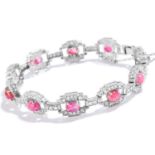 A VINTAGE RUBY AND DIAMOND BRACELET in 18ct white gold, comprising of ten cabochon rubies in