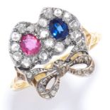 A RUBY, SAPPHIRE AND DIAMOND SWEETHEART RING in 18ct yellow gold and silver, the double heart