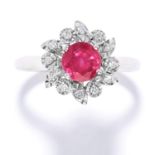 RUBY AND DIAMOND CLUSTER RING in white gold, set with a round cut ruby in a cluster of round cut