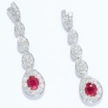 RUBY AND DIAMOND EARRINGS in 18ct white gold, each comprising of a row of baguette and round cut