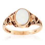 AN OPAL DRESS RING in yellow gold, set with an oval cabochon opal, British hallmarks, size P / 7.