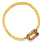 VINTAGE CITRINE PENDANT in yellow gold, set with a large emerald cut citrine on yellow cord