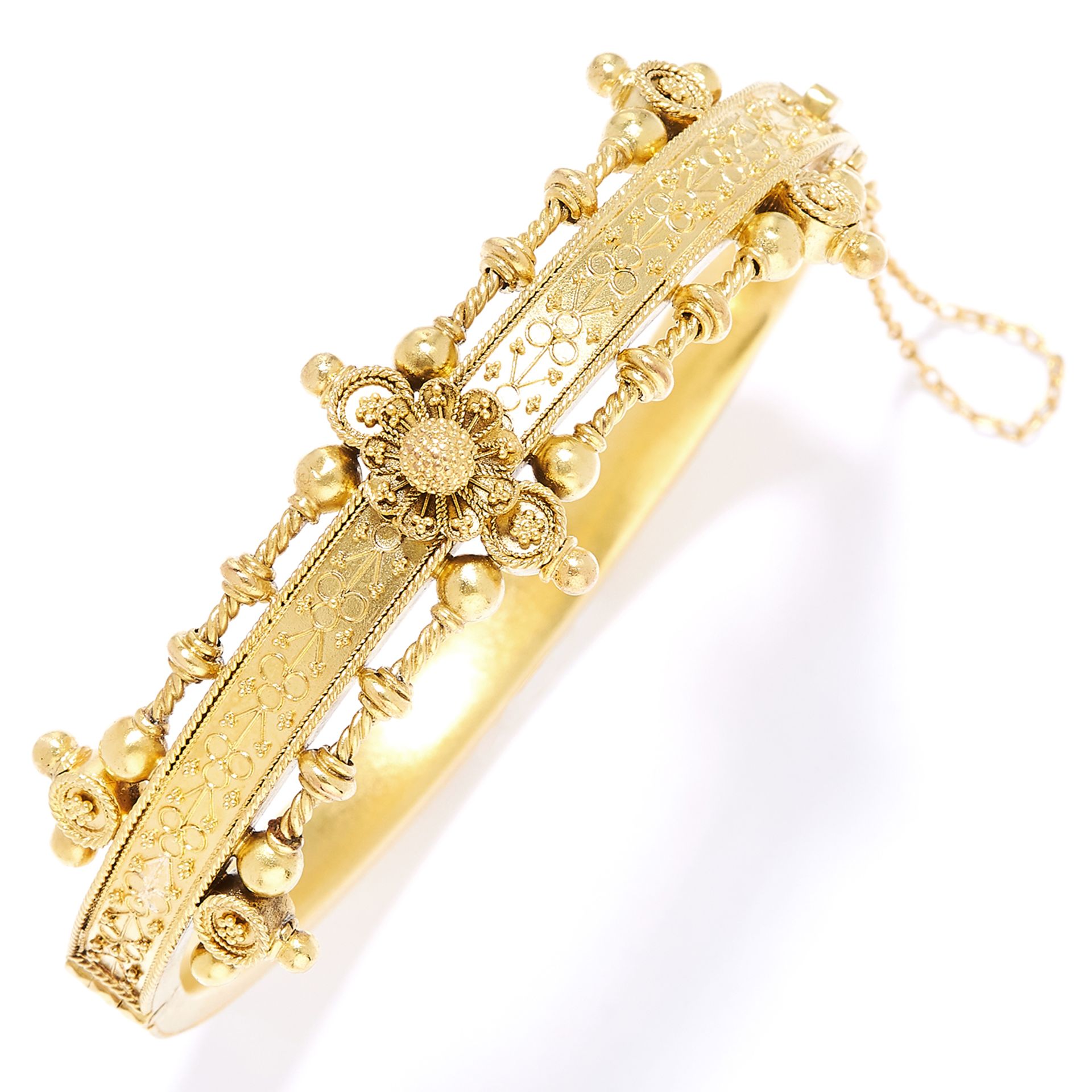 ANTIQUE BANGLE, 19TH CENTURY in high carat yellow gold decorated with bead and ropework designs,