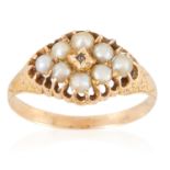 AN ANTIQUE PEARL AND DIAMOND RING in yellow gold, set with eight seed pearls and a rose cut diamond,