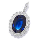 SAPPHIRE AND DIAMOND PENDANT in white gold or platinum, comprising of an oval cut synthetic sapphire