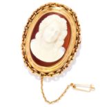 ANTIQUE CARVED CAMEO BROOCH in high carat yellow gold, depicting a lady in gold border, unmarked,