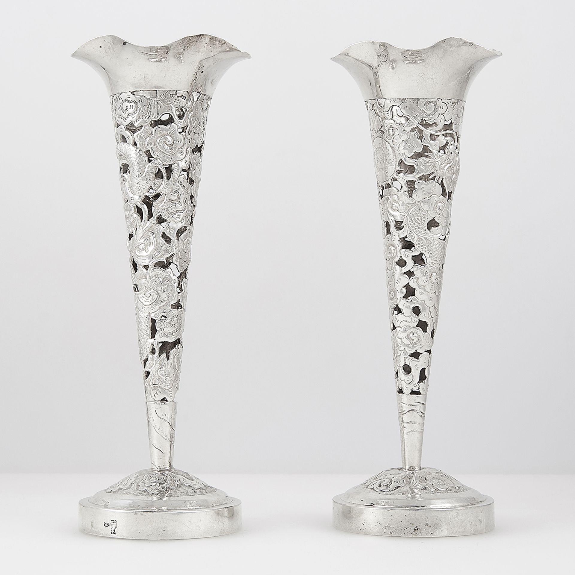 PAIR OF ANTIQUE CHINESE SILVER VASES CIRCA 1900 the fluted bodies with pierced and chased