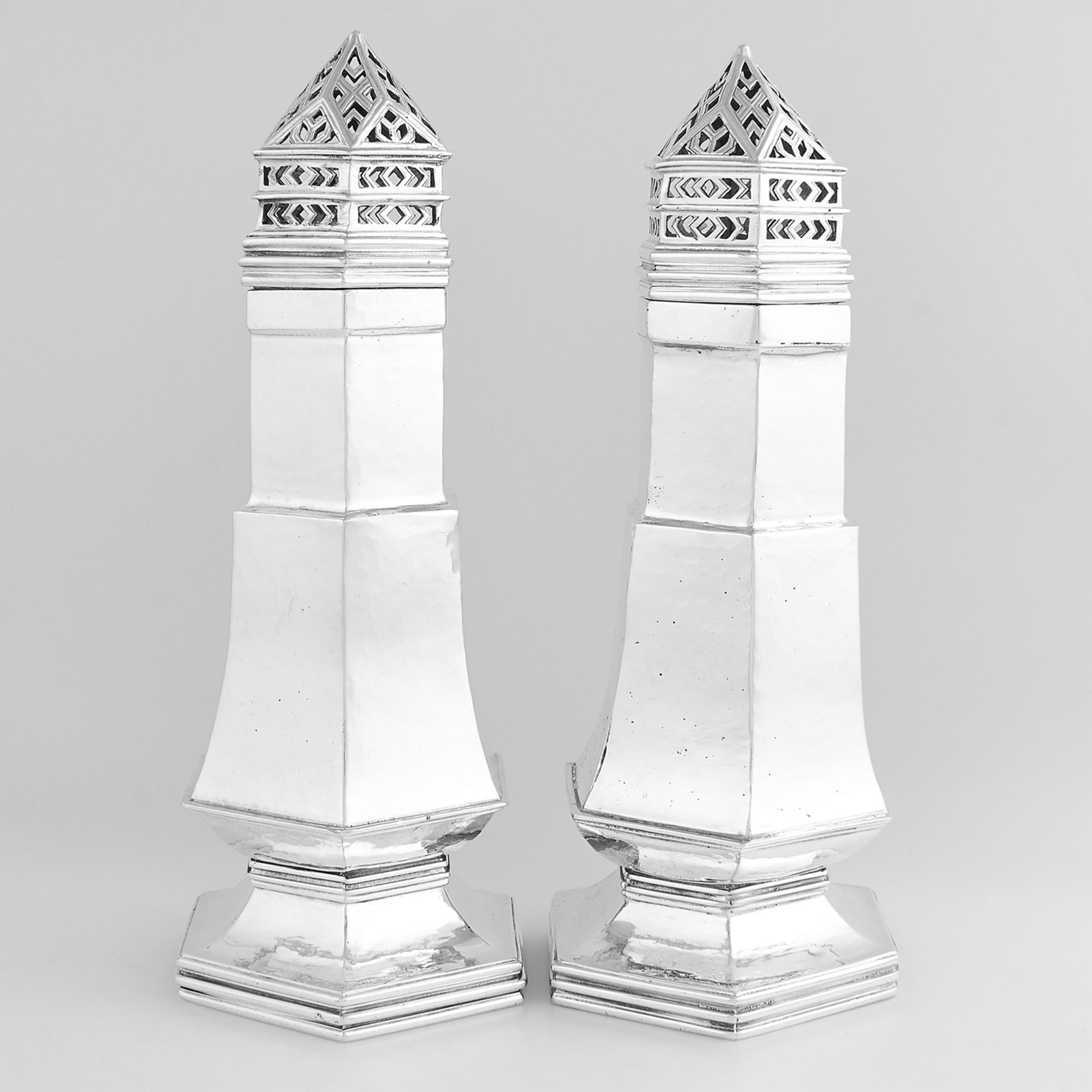 PAIR OF ANTIQUE ARTS & CRAFTS SUGAR CASTORS, OMAR RAMSDEN LONDON 1933 of hexagonal form, with