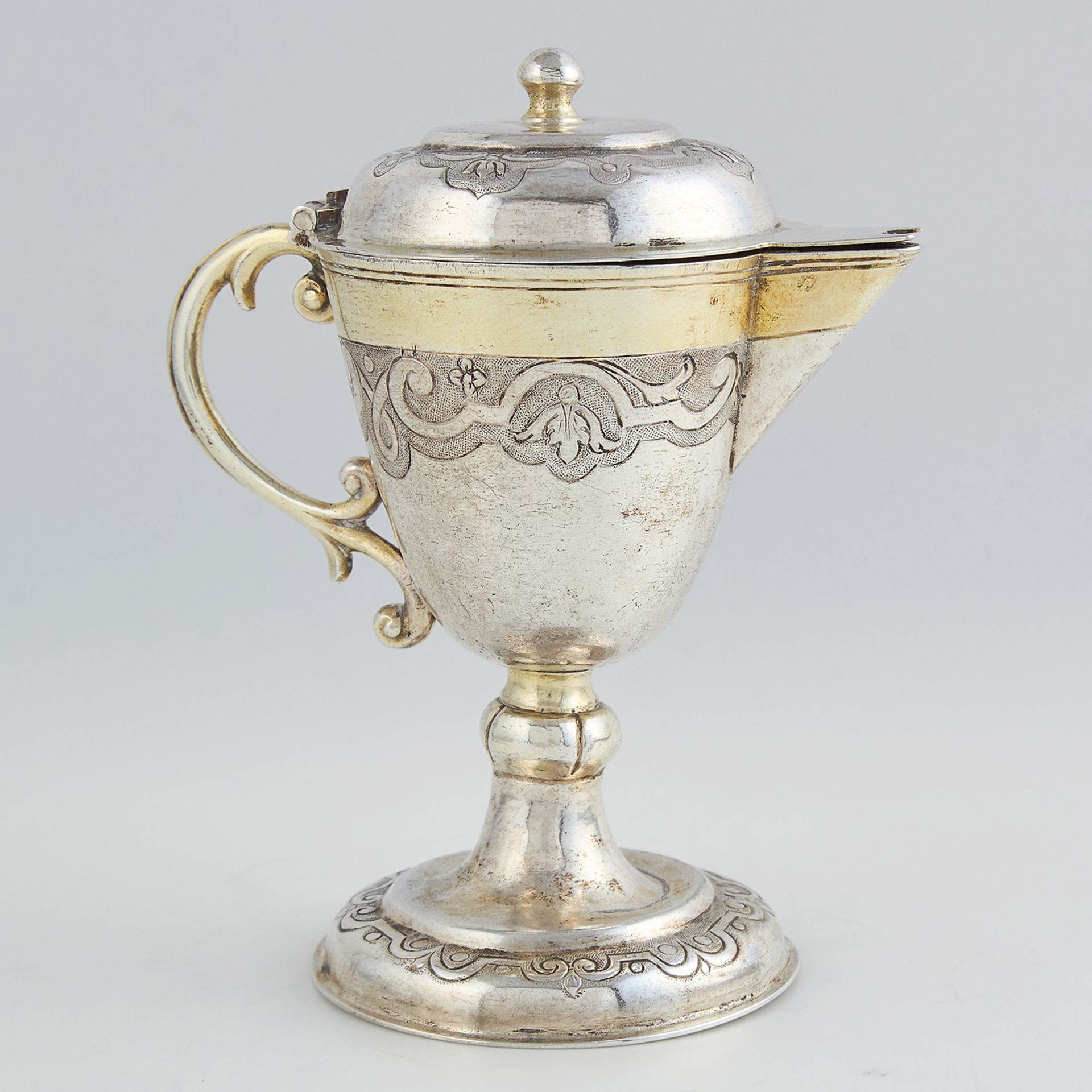 ANTIQUE GERMAN PARCEL GILT SILVER MINIATURE FLAGON the rounded tapering body atop a spreading