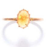 OPAL DRESS RING in yellow gold, set with a cabochon fire opal, unmarked, size M / 6.5, 1.4g.