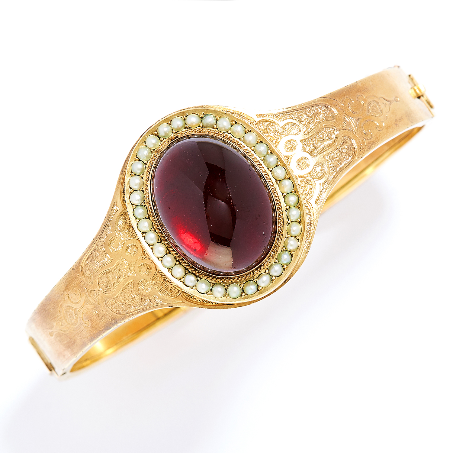 ANTIQUE GARNET AND PEARL BANGLE in high carat yellow gold, comprising a cabochon garnet in a