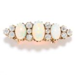 OPAL AND DIAMOND BROOCH in yellow gold, set with three cabochon opal and alternating old cut