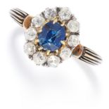 ANTIQUE SAPPHIRE AND DIAMOND CLUSTER RING in yellow gold, set with an oval cut sapphire in a cluster