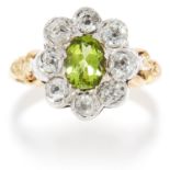 PERIDOT AND DIAMOND CLUSTER RING in yellow gold, set with an oval cut peridot in cluster of old