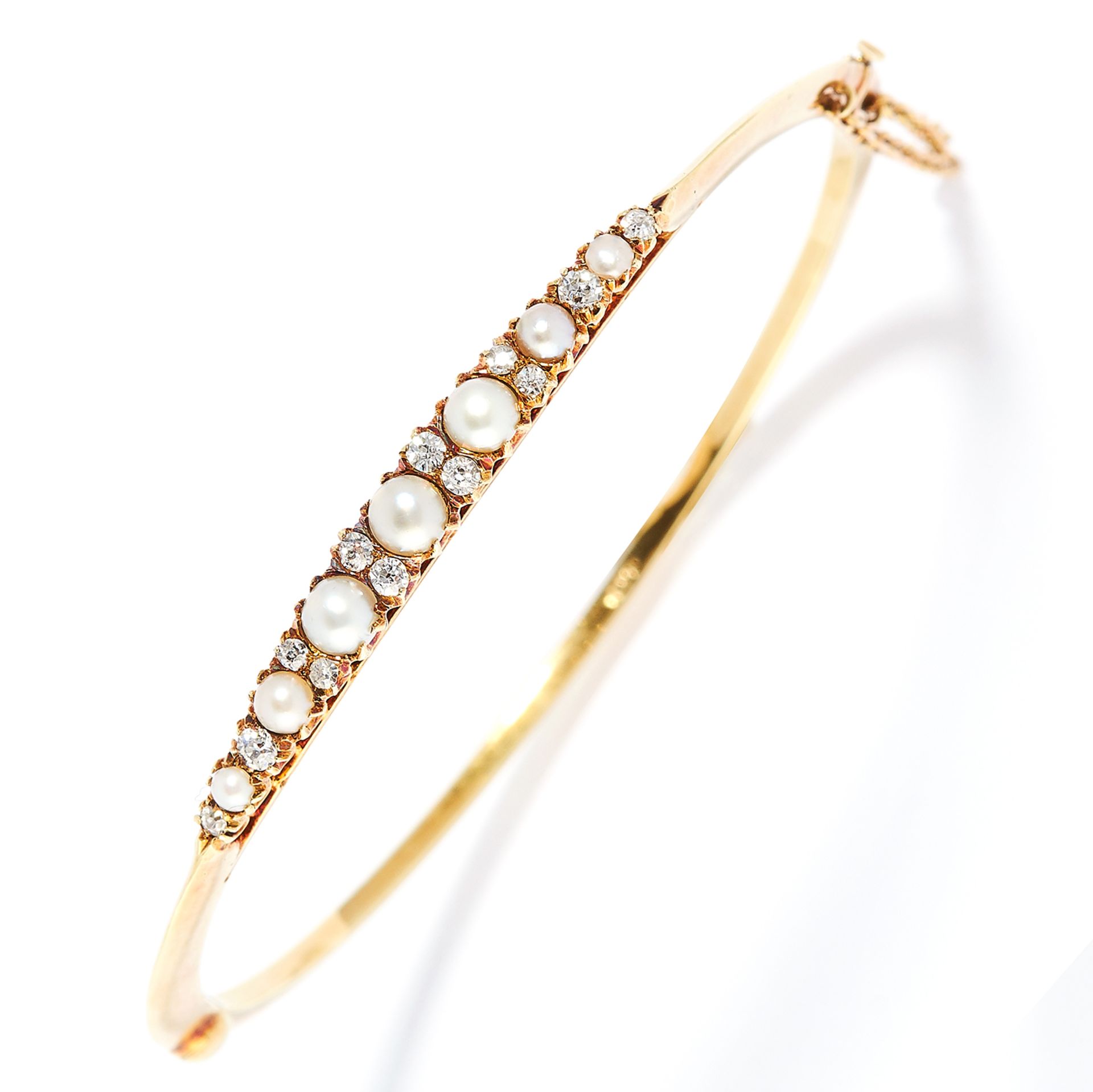 PEARL AND DIAMOND BANGLE in 15ct yellow gold, set with alternating round cut diamonds and pearls,