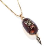 ANTIQUE GARNET AND DIAMOND MOURNING PENDANT in yellow gold, comprising of a cabochon garnet and