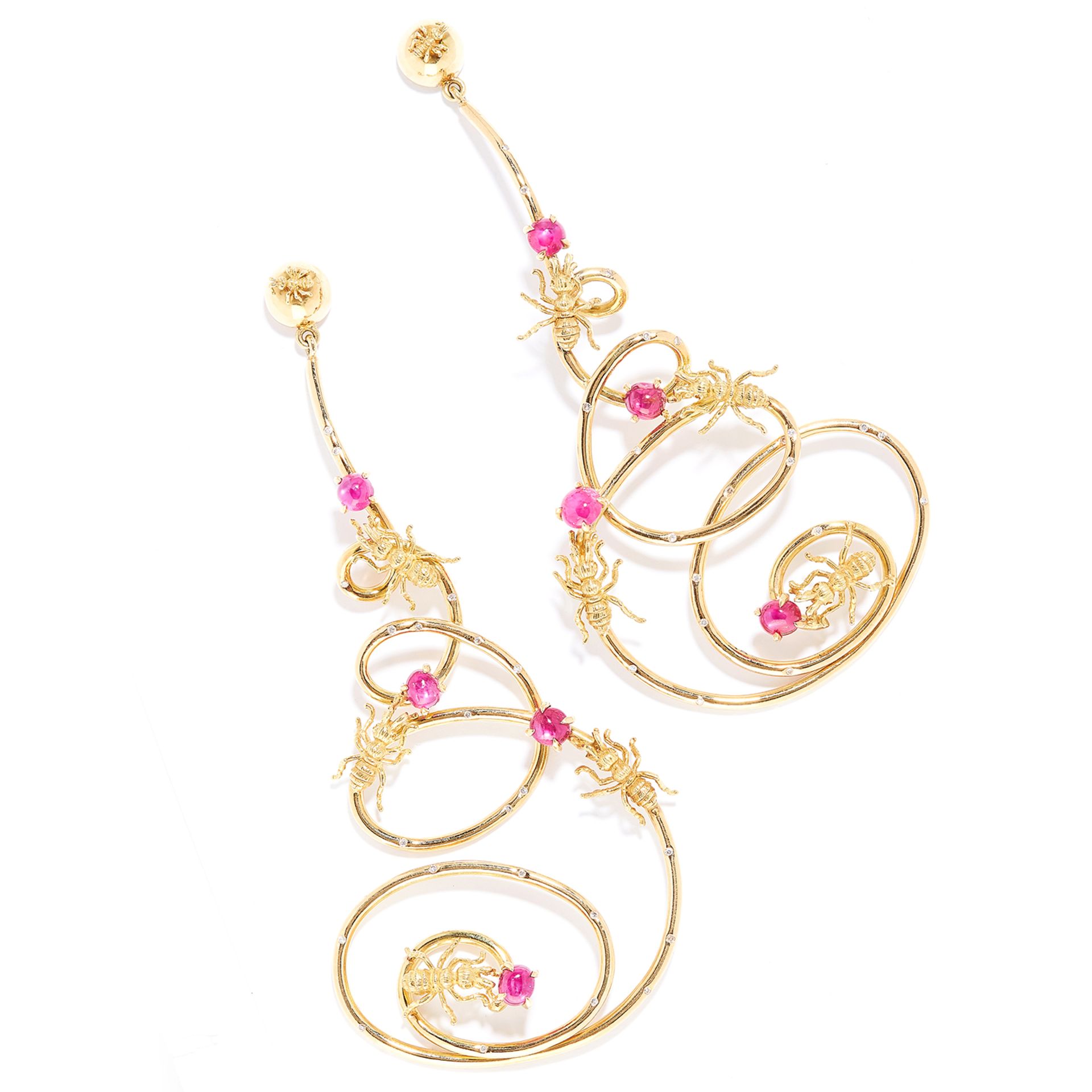 RUBY AND DIAMOND ANT EARRINGS in 18ct yellow gold, each designed as a tapering coiled path