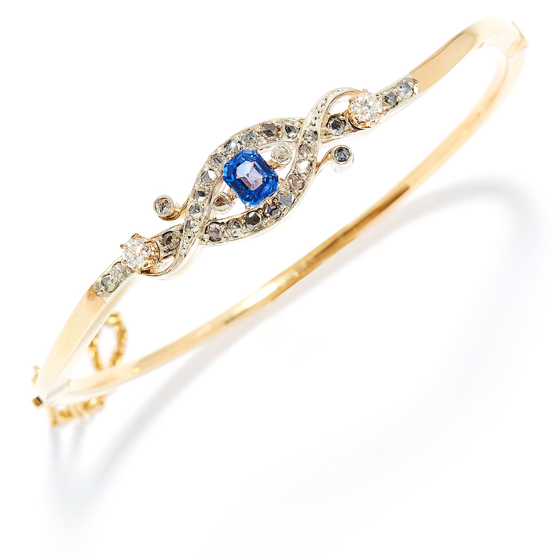 ANTIQUE SAPPHIRE AND DIAMOND BANGLE, 19TH CENTURY in yellow gold and silver, the step cut blue