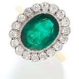 EMERALD AND DIAMOND CLUSTER RING in 18ct yellow gold, set with an oval cut emerald of