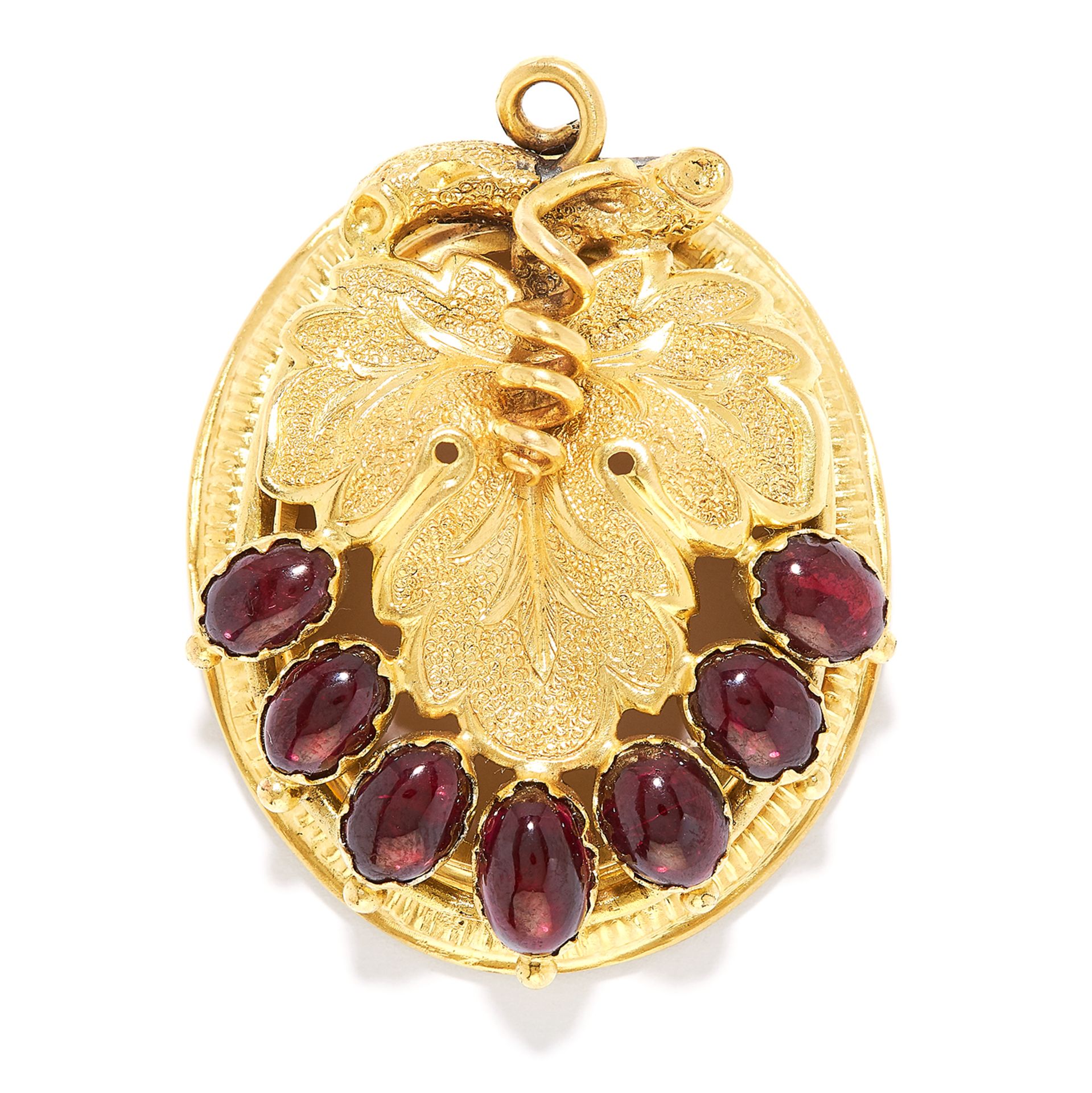 GARNET PENDANT in high carat yellow gold, the hinged body depicting a leaf set with cabochon