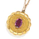 ANTIQUE GARNET AND HAIRWORK MOURNING PENDANT in high carat yellow gold, set with an oval cut