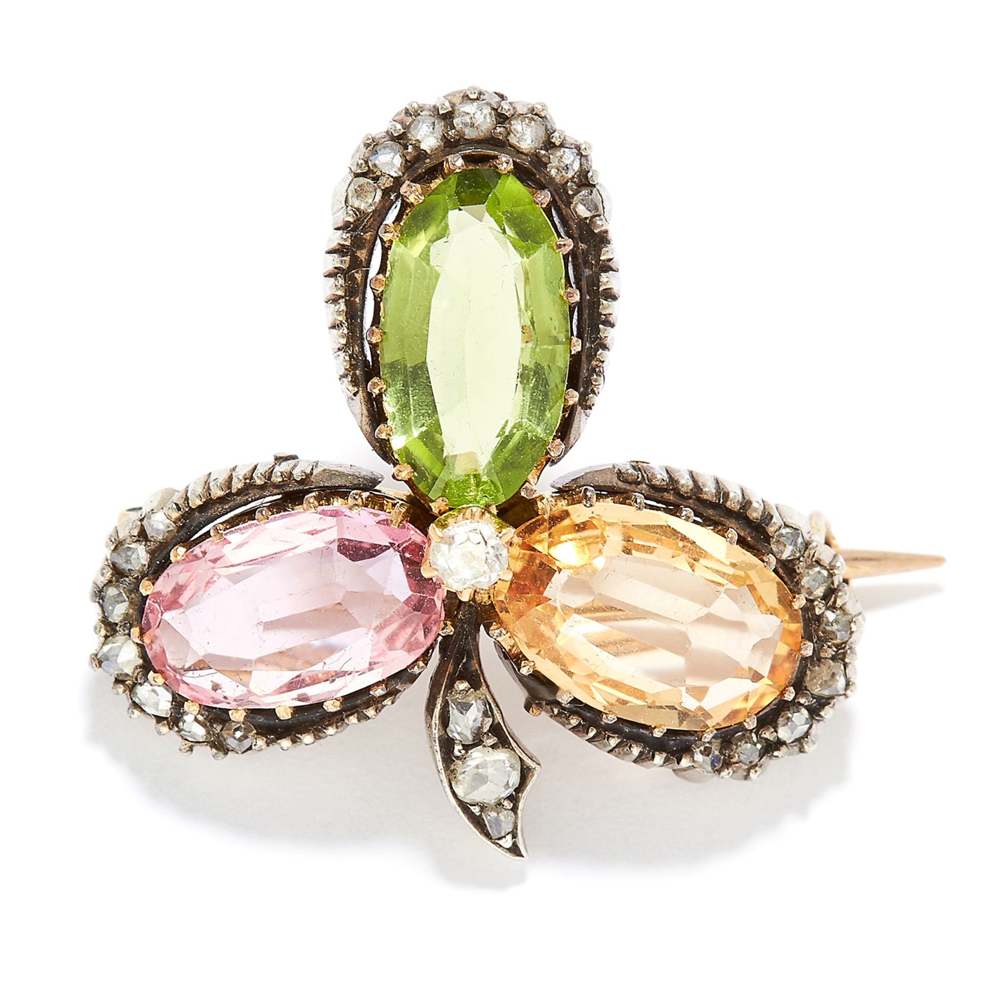 ANTIQUE PERIDOT, TOPAZ AND DIAMOND CLOVER BROOCH in yellow gold, set with an oval cut peridot,
