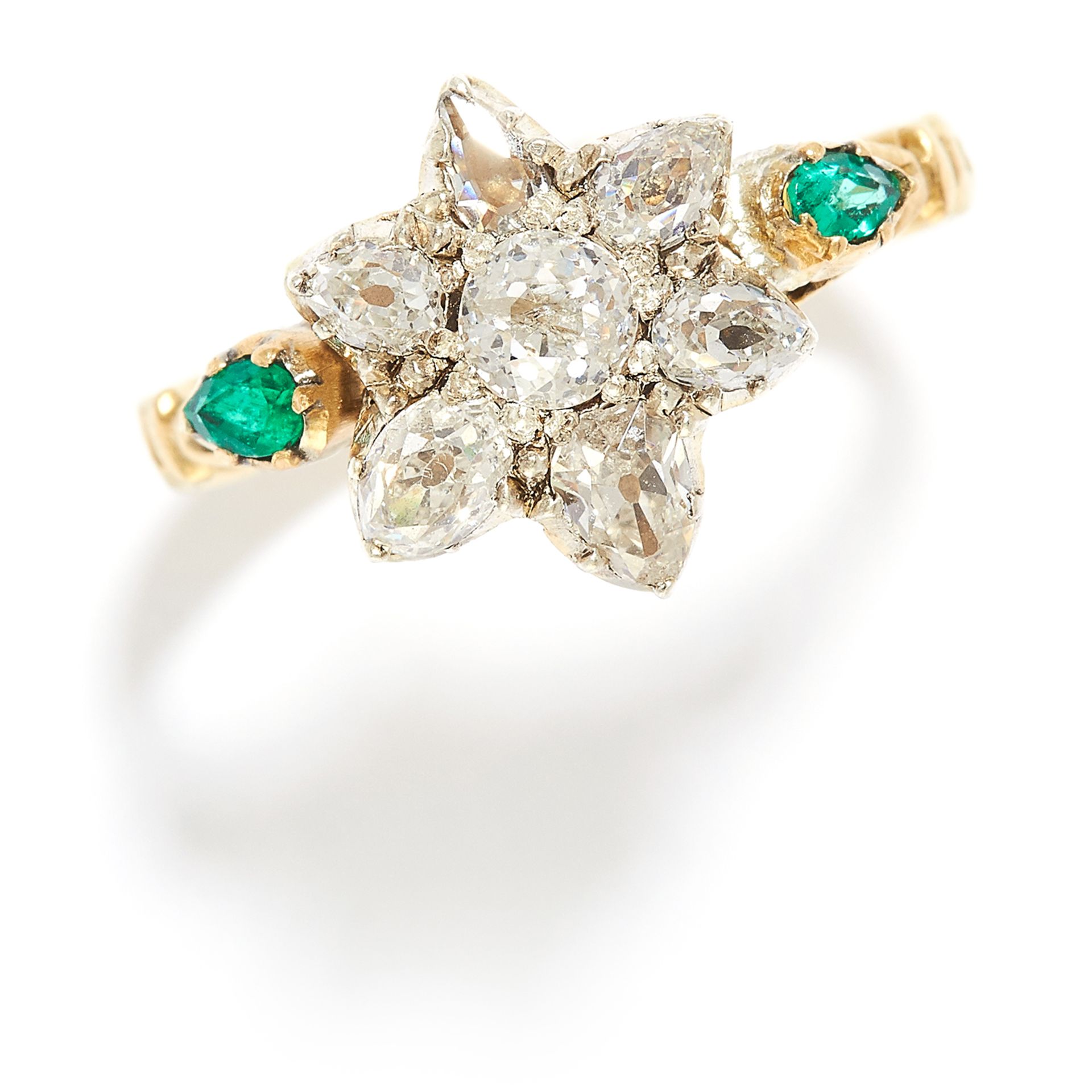 ANTIQUE DIAMOND AND EMERALD RING in yellow gold and silver, the floral motif jewelled with old and