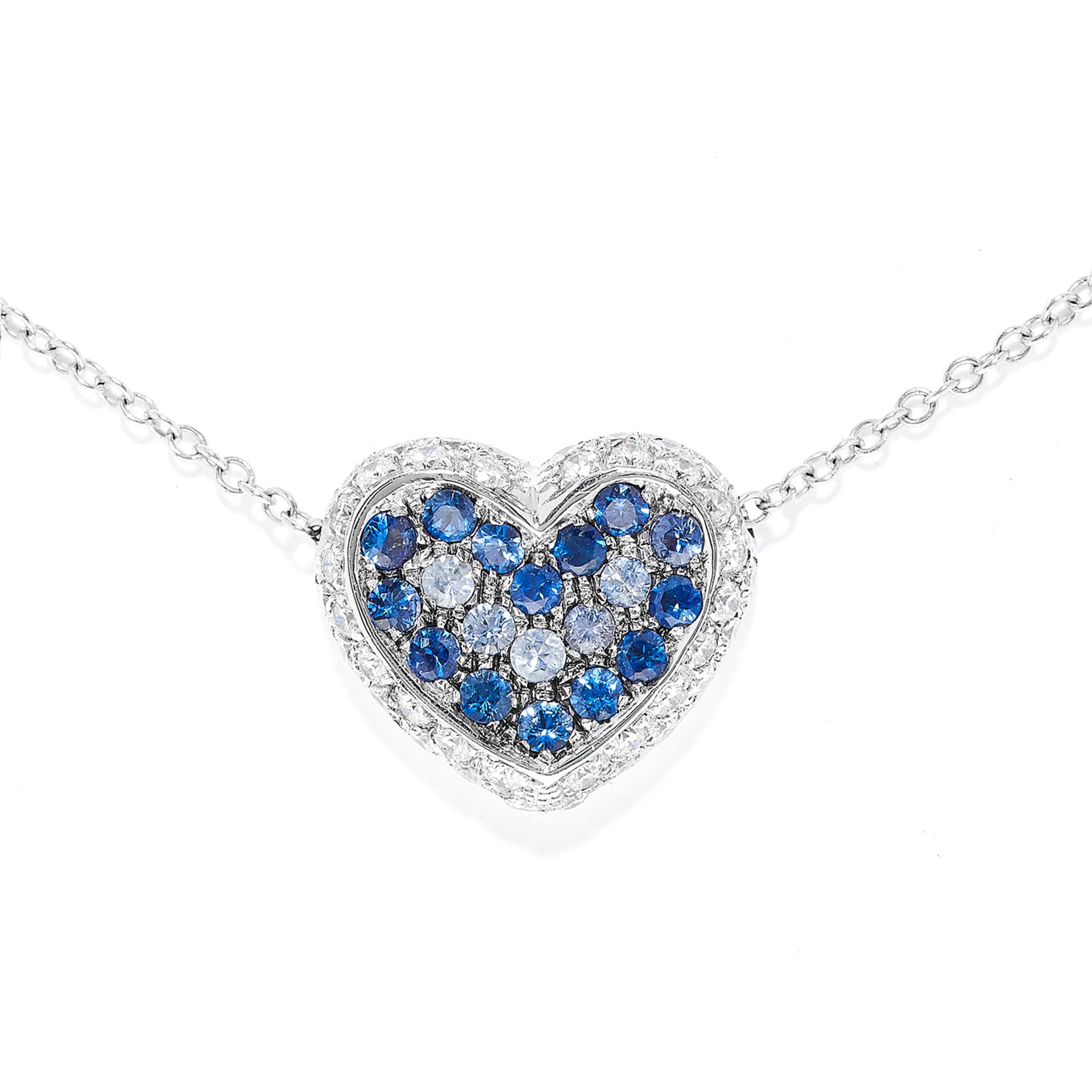 SAPPHIRE AND DIAMOND PENDANT in 18ct white gold, depicting a heart set with round cut sapphires