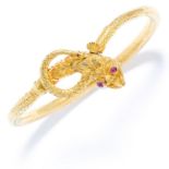 ANTIQUE RUBY SNAKE / SERPENT BANGLE in high carat yellow gold, depicting a dragon coiled around