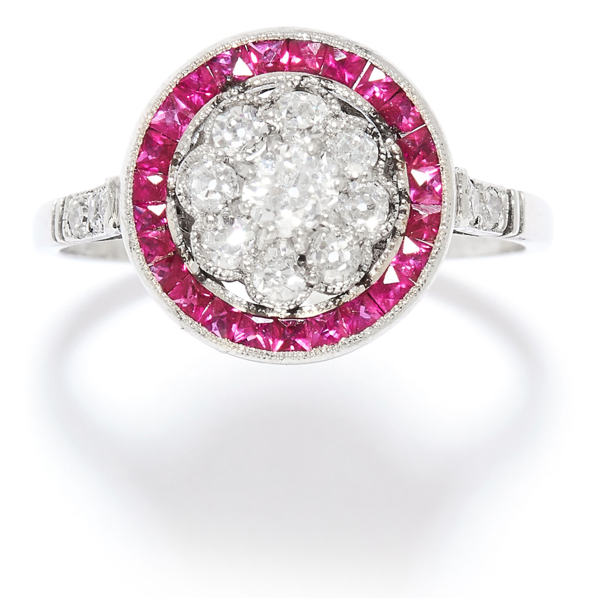 ART DECO DIAMOND AND RUBY RING in platinum or white gold, the central floral cluster set with old