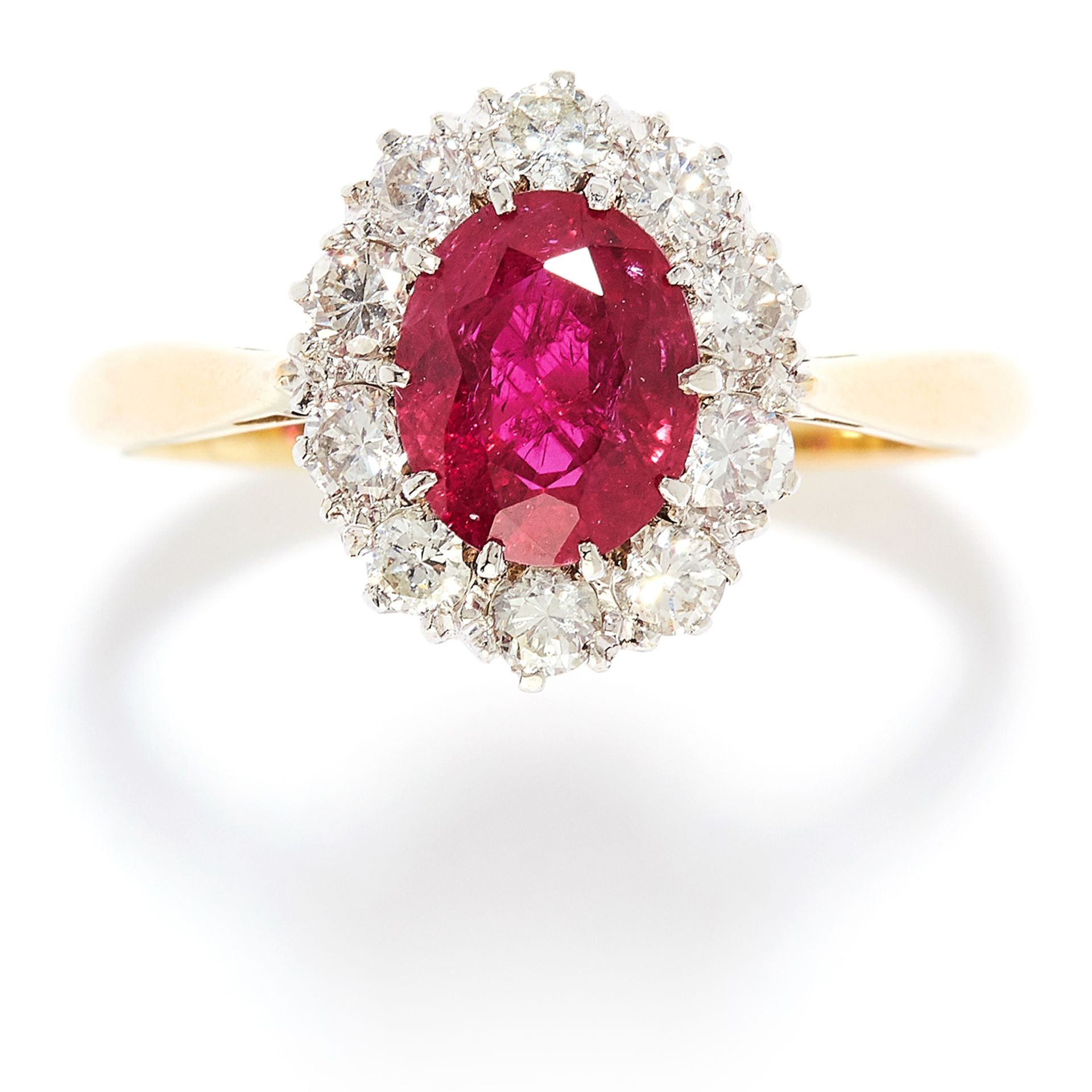 1.20 CARAT RUBY AND DIAMOND CLUSTER RING in 18ct yellow gold, set with a oval cut ruby of