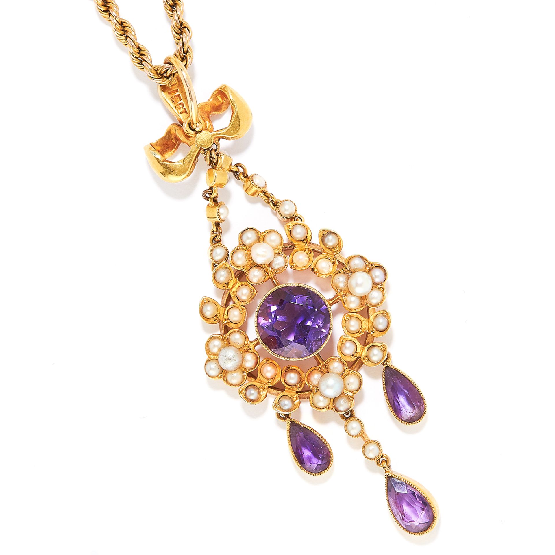 ANTIQUE AMETHYST AND PEARL PENDANT in 15ct and 9ct yellow gold, in foliate and ribbon motif set with