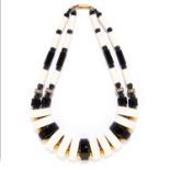 ANTIQUE JEWELLED ENAMEL NECKLACE, EARLY 20TH CENTURY alternating black and white geometric links